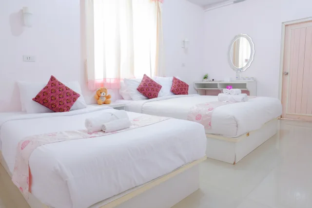 Twin beds in a guest room — Wiang Phumin Hotel